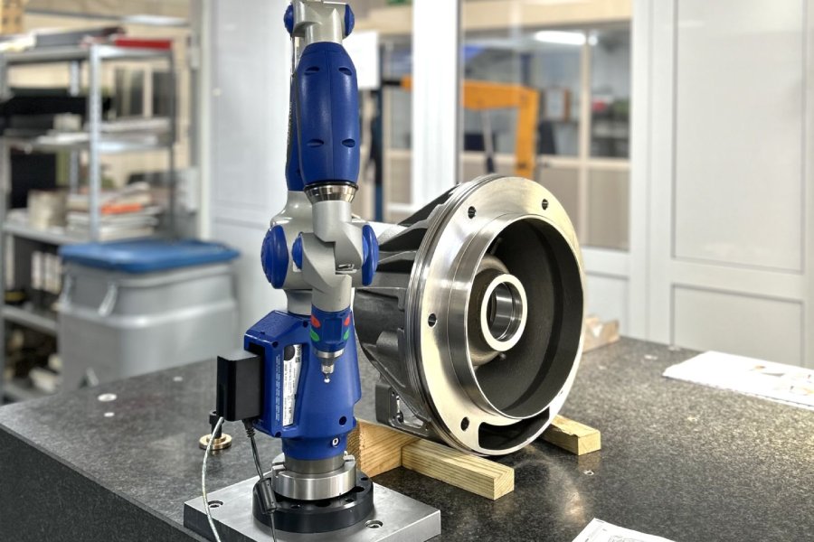 Dimensional inspection of a machined centrifugal pump component using a measuring arm